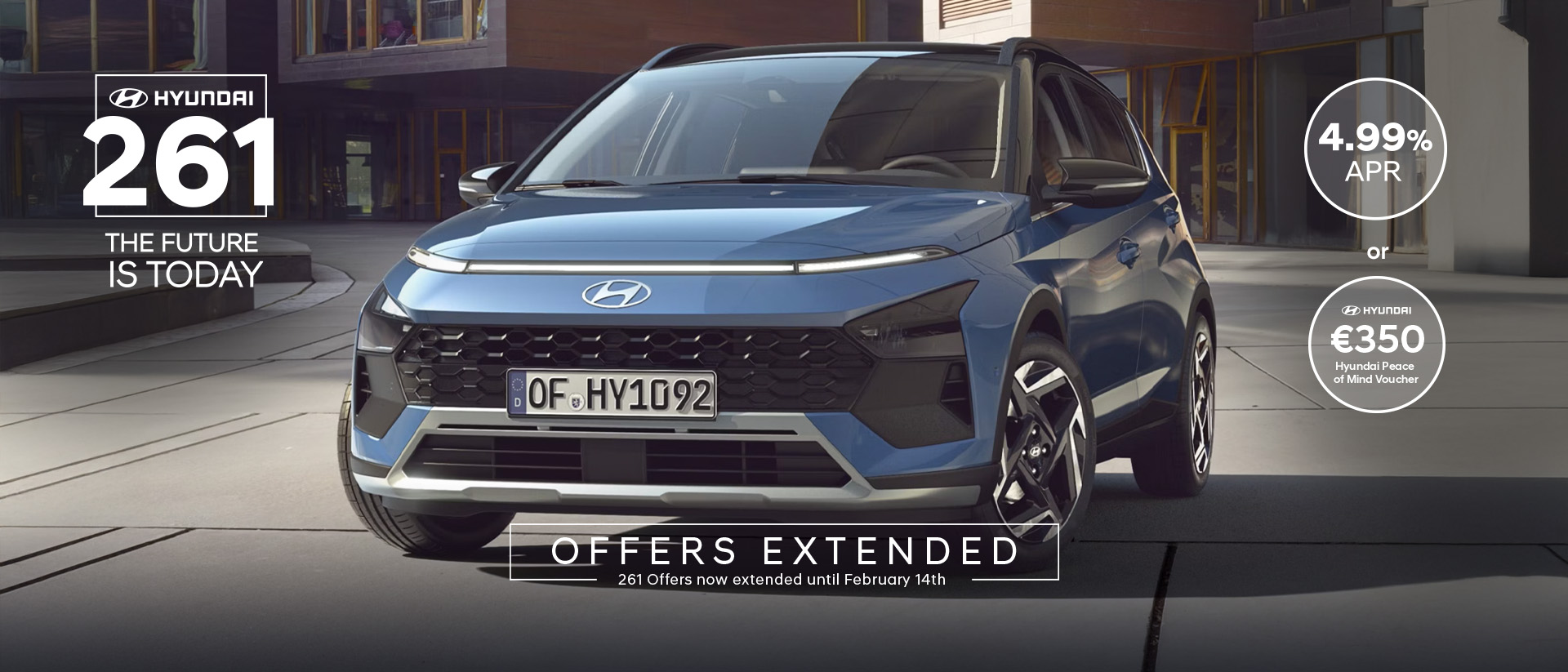 The new Hyundai BAYON is seen the front, with urban housing in the background.